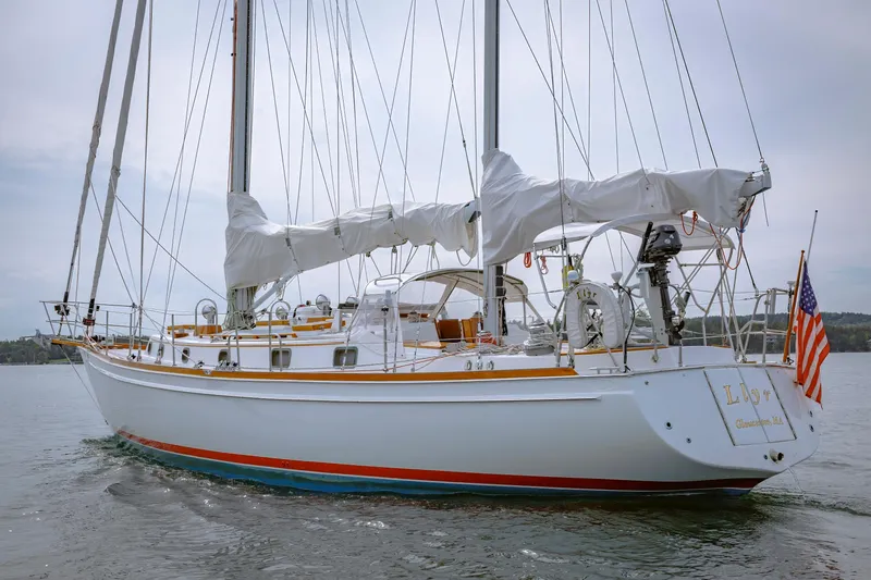Slide: The Image of Sailing yacht Shannon 47/52, 2001 model, cruising on calm waters with American flag. - 16