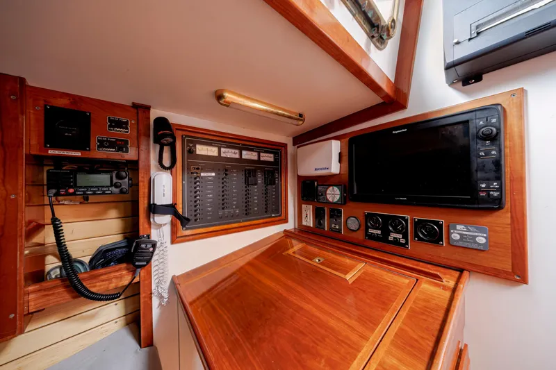 Slide: The Image of Navigation station on a 2001 Shannon 47/52 yacht with control panels and communication equipment. - 42