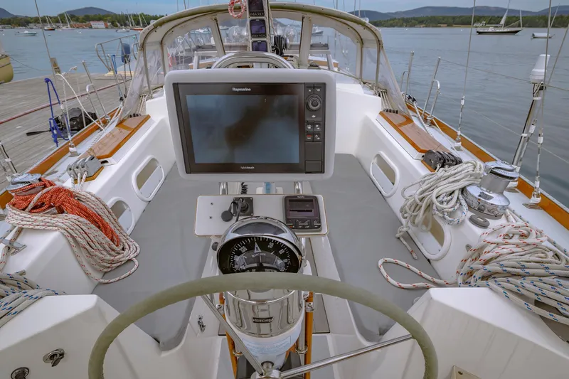 Slide: The Image of Cockpit of a 2001 Shannon 47/52 sailboat with navigation equipment and ropes. - 30