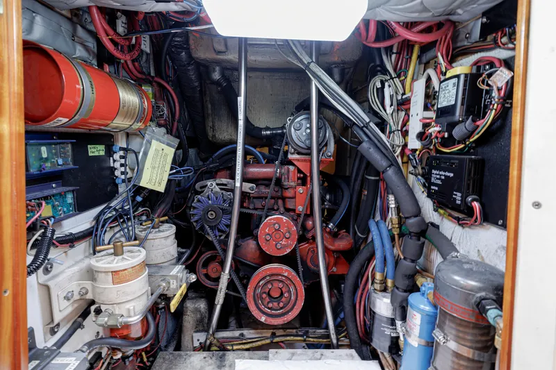 Slide: The Image of Engine room of a 2001 Shannon 47/52 boat, featuring complex wiring and machinery. - 65