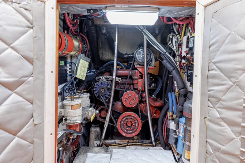 Slide: The Image of Engine room of a 2001 Shannon 47/52 yacht, showcasing complex machinery and wiring. - 64