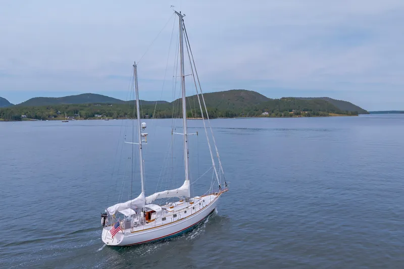 Slide: The Image of Sailing yacht Shannon 47/52 (2001) cruising on calm waters with scenic mountain backdrop. - 8