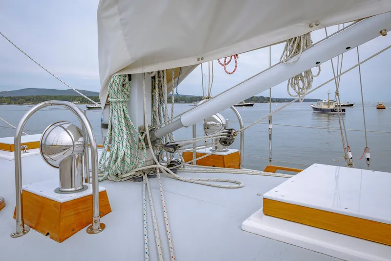 Slide: The Image of Sailboat deck view with ropes and winches, Shannon 47/52 model, 2001, on calm water. - 24