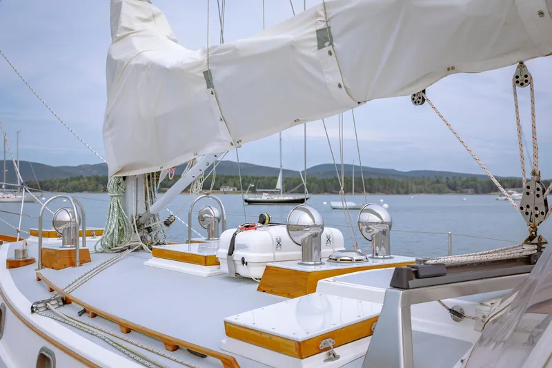 Slide: The Image of Sailboat deck view, Shannon 47/52 model, 2001, with scenic lake and hills in background. - 22