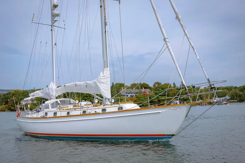 The Image of Sailing yacht Shannon 47/52, 2001 model, anchored in calm waters with lush greenery background. - 0