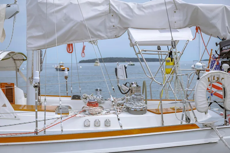 Slide: The Image of Sailboat deck with ropes and equipment, Shannon 47/52 model, 2001, on calm water. - 26
