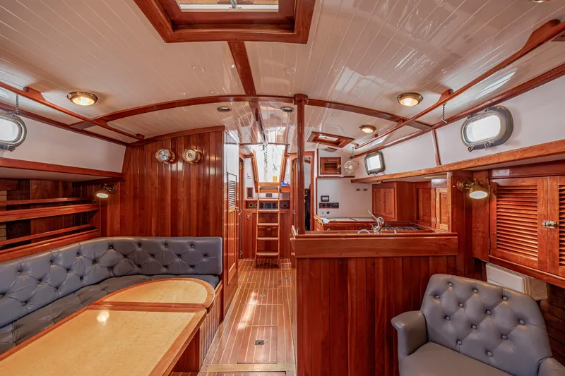 Slide: The Image of Luxurious wooden interior of a 2001 Shannon 47/52 yacht with elegant seating and lighting. - 33