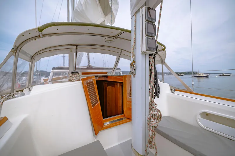 Slide: The Image of Sailboat cockpit view, Shannon 47/52 model, 2001, with open hatch and ropes. - 32