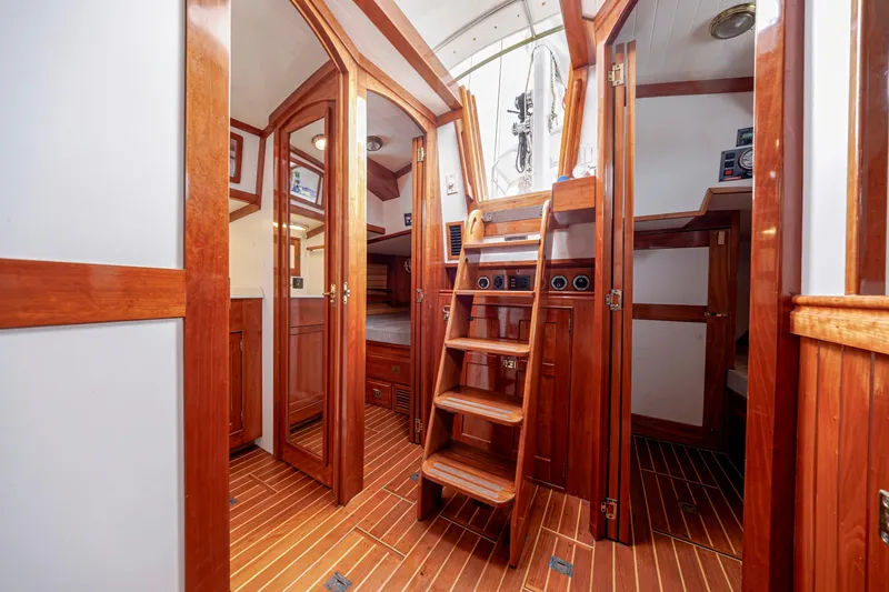 Slide: The Image of Interior of 2001 Shannon 47/52 yacht with wooden finishes and staircase. - 44