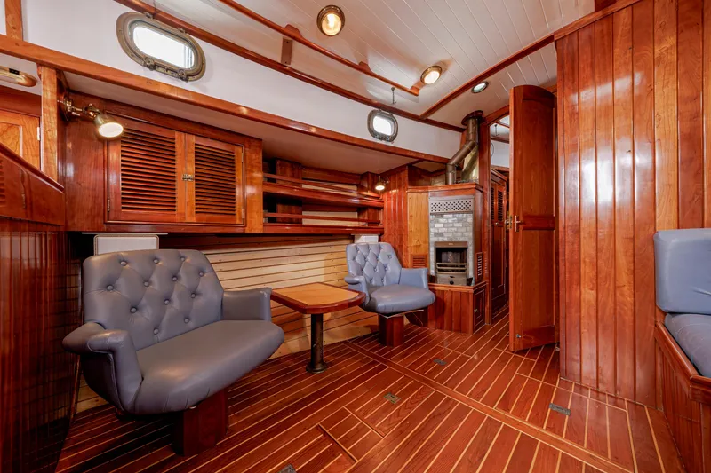 Slide: The Image of Luxurious wooden interior of a 2001 Shannon 47/52 yacht with plush seating and elegant design. - 50