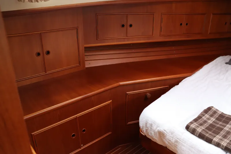 Slide: The Image of Luxurious wooden cabin interior of 1996 Eastbay 40 Express Grand Banks yacht. - 30