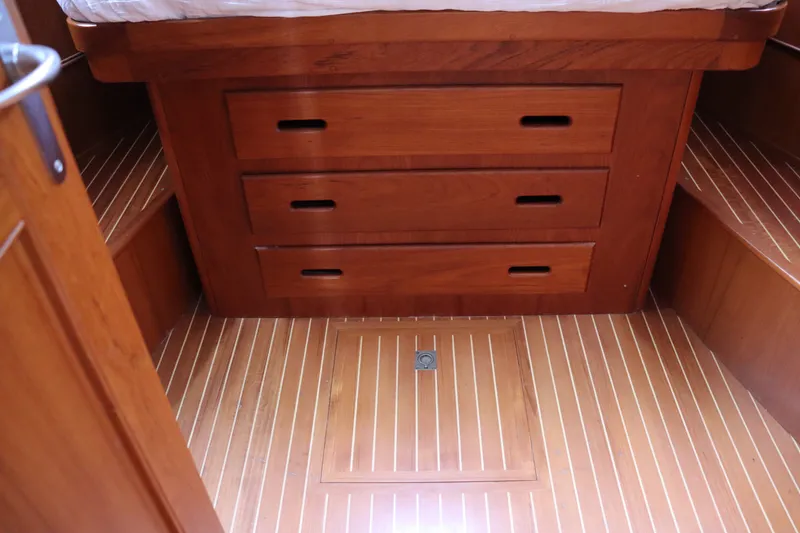 Slide: The Image of Wooden interior of 1996 Eastbay 40 Express Grand Banks with drawers and flooring. - 32