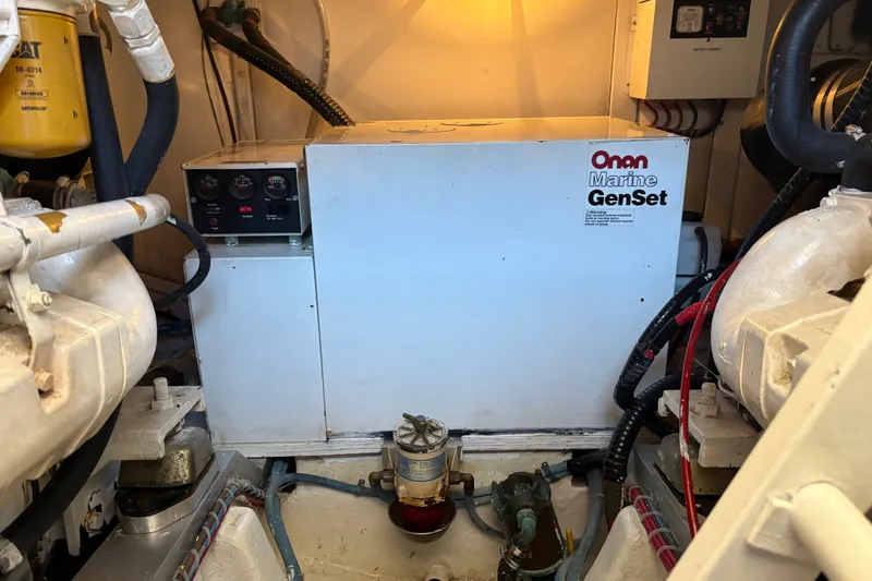 Slide: The Image of Engine room of 1996 Grand Banks 40 Eastbay EX with Onan Marine GenSet. - 38