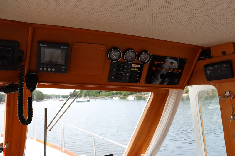 Slide: The Image of Interior view of 1996 Eastbay 40 Express Grand Banks yacht dashboard with gauges and controls. - 17