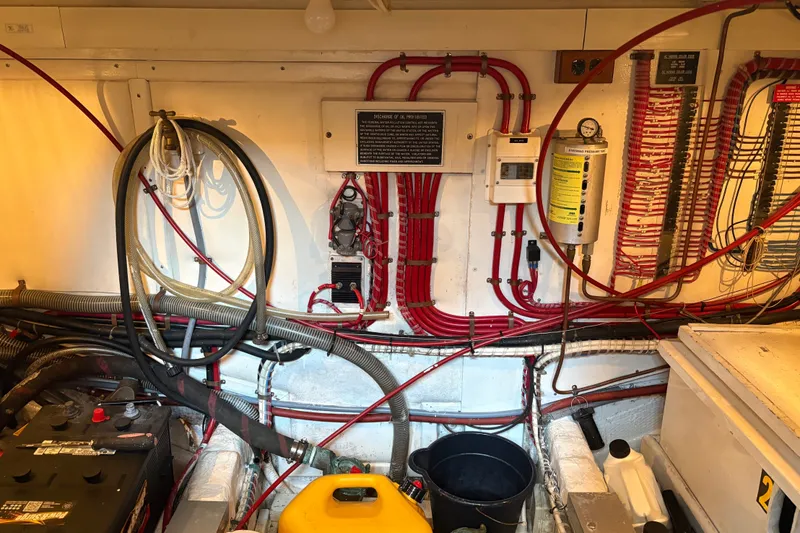 Slide: The Image of Engine room of 1996 Grand Banks 40 Eastbay EX with wiring and equipment. - 40