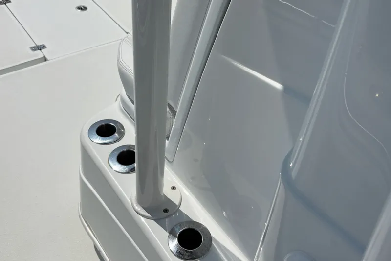 Slide: The Image of 2021 Yellowfin 26 Hybrid boat deck with rod holders and sleek design. - 17