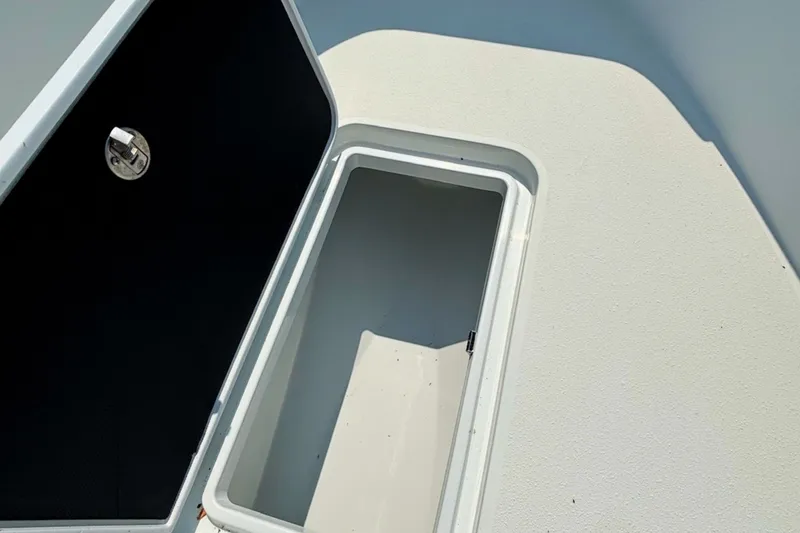 Slide: The Image of Open storage compartment on 2021 Yellowfin 26 Hybrid boat deck. - 22