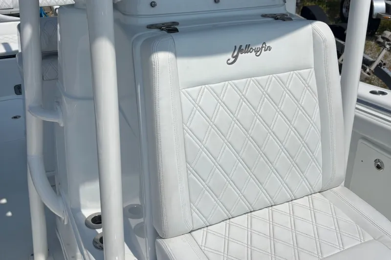 Slide: The Image of 2021 Yellowfin 26 Hybrid boat seat with diamond-stitched white upholstery. - 19