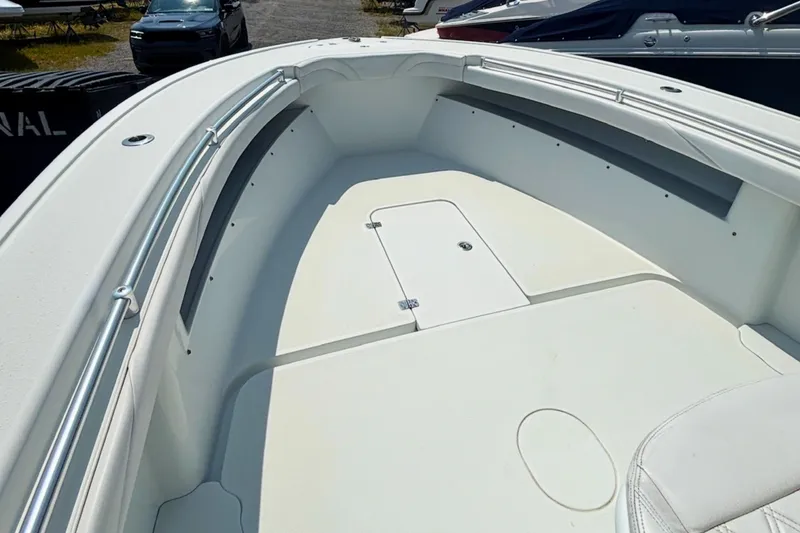 Slide: The Image of 2021 Yellowfin 26 Hybrid boat interior with spacious deck and storage compartment. - 21
