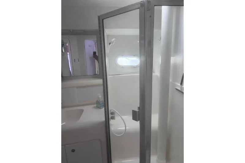 Slide: The Image of Bathroom interior of 1996 Silverton 41 Convertible yacht with shower and sink. - 22