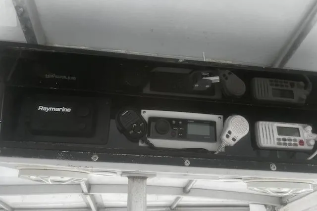 Slide: The Image of Control panel of a 1996 Silverton 41 Convertible boat with Raymarine equipment. - 11