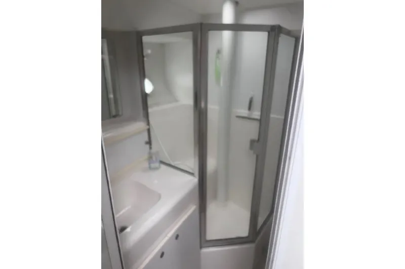 Slide: The Image of Bathroom interior of 1996 Silverton 41 Convertible yacht with shower and sink. - 21