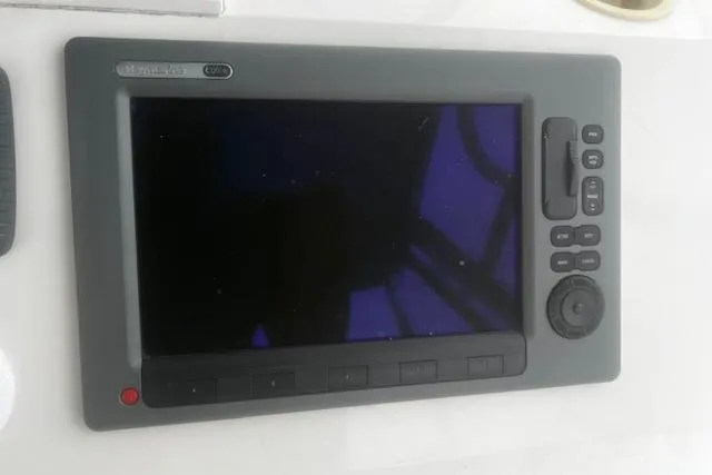 Slide: The Image of Marine navigation display on a 1996 Silverton 41 Convertible boat dashboard. - 10