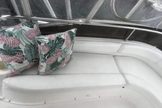 Slide: The Image of White seating area on 1996 Silverton 41 Convertible with tropical-themed cushions. - 12