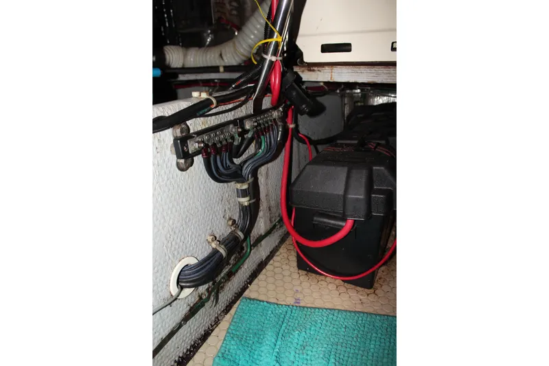 Slide: The Image of Engine room wiring and battery setup in a 1996 Silverton 41 Convertible boat. - 39