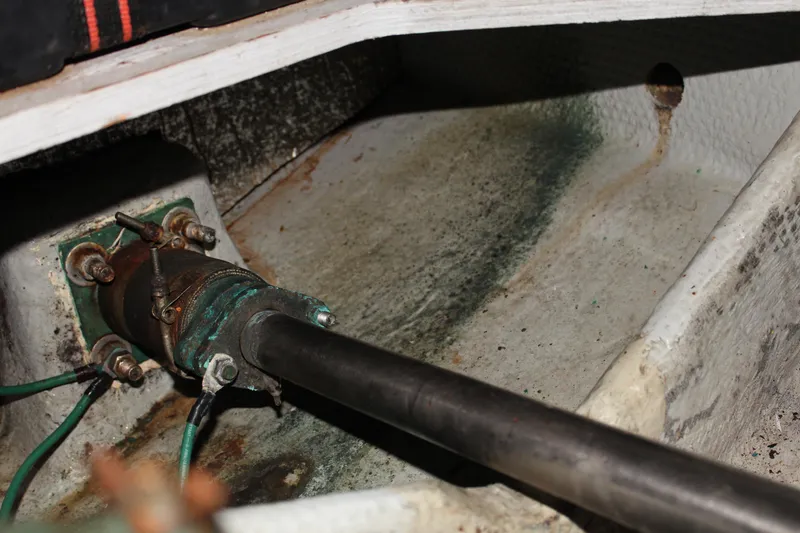 Slide: The Image of Close-up of a 1996 Silverton 41 Convertible boat's propeller shaft and bilge area. - 37
