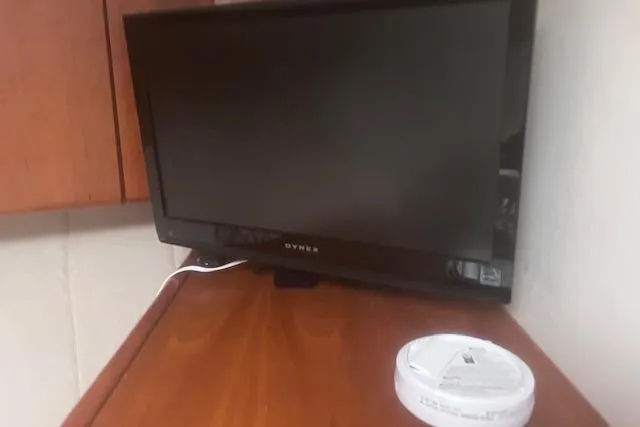 Slide: The Image of Television on wooden surface inside 1996 Silverton 41 Convertible boat cabin. - 19