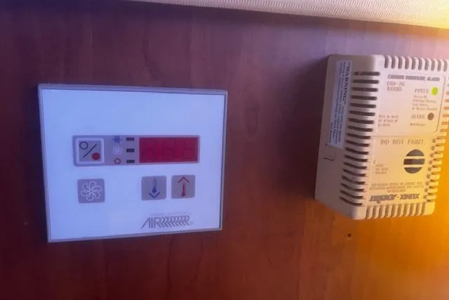 Slide: The Image of Control panel and detector on 1996 Silverton 41 Convertible yacht interior. - 18