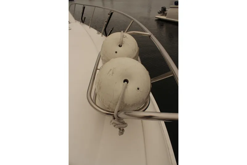 Slide: The Image of Bow view of 1996 Silverton 41 Convertible with fenders and railing. - 32