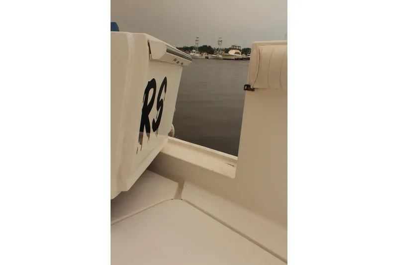 Slide: The Image of 1996 Silverton 41 Convertible boat deck with water view in the background. - 41