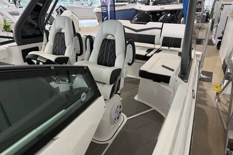 Slide: The Image of Interior of 2027 Monterey Elite 27 OB boat with luxurious seating and modern design. - 7