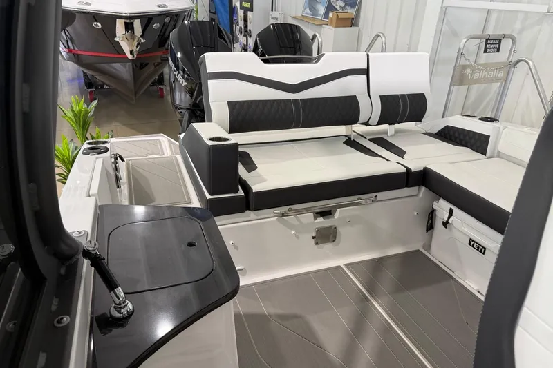 Slide: The Image of 2027 Monterey Elite 27 OB boat interior with sleek seating and modern design. - 12