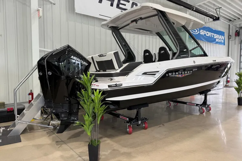 Slide: The Image of 2027 Monterey Elite 27 OB boat with Mercury outboard engine in showroom display. - 2