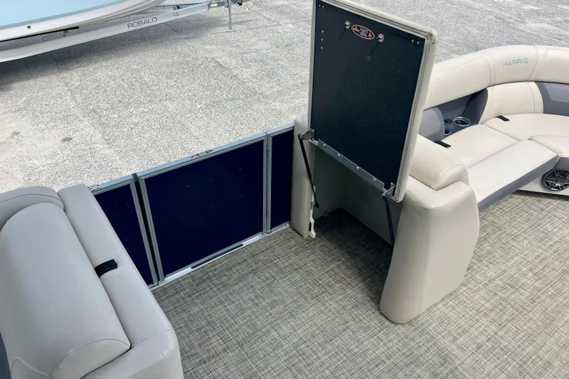 Slide: The Image of 2023 Harris Cruiser 230 boat interior with plush seating and modern design. - 16