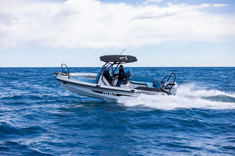 Slide: The Image of Highfield ADV7 2027 boat cruising on open sea under clear sky. - 2
