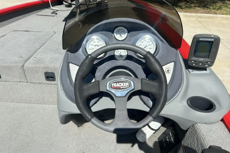 Slide: The Image of 2008 Tracker Pro Team 175 TXW boat dashboard with steering wheel and gauges. - 4
