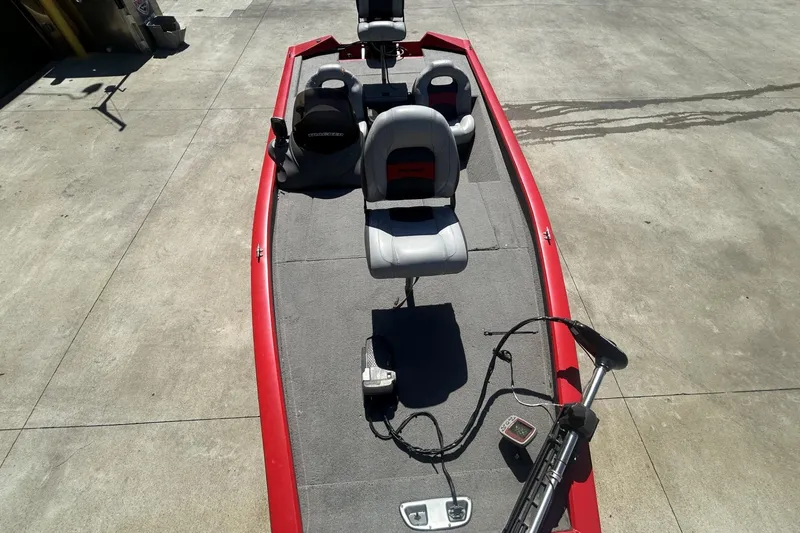 Slide: The Image of 2008 Tracker Pro Team 175 TXW fishing boat with red trim and seating. - 10