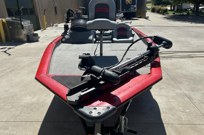 Slide: The Image of 2008 Tracker Pro Team 175 TXW fishing boat with red trim, parked outdoors. - 5