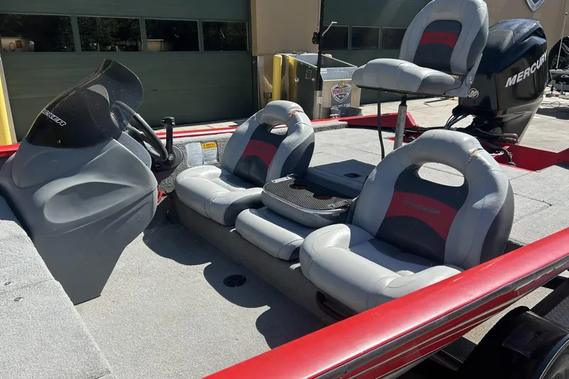 Slide: The Image of 2008 Tracker Pro Team 175 TXW boat interior with seating and steering console. - 7