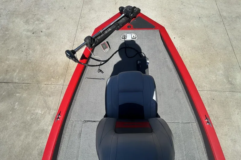 Slide: The Image of 2008 Tracker Pro Team 175 TXW boat interior with red trim and gray seating. - 9