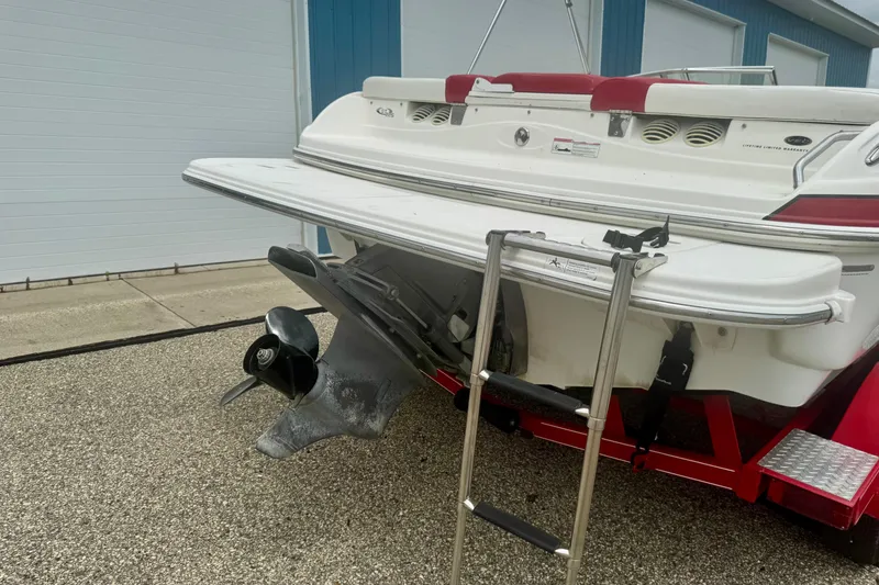Slide: The Image of 2008 Glastron GT 225 boat rear view with ladder and propeller. - 61