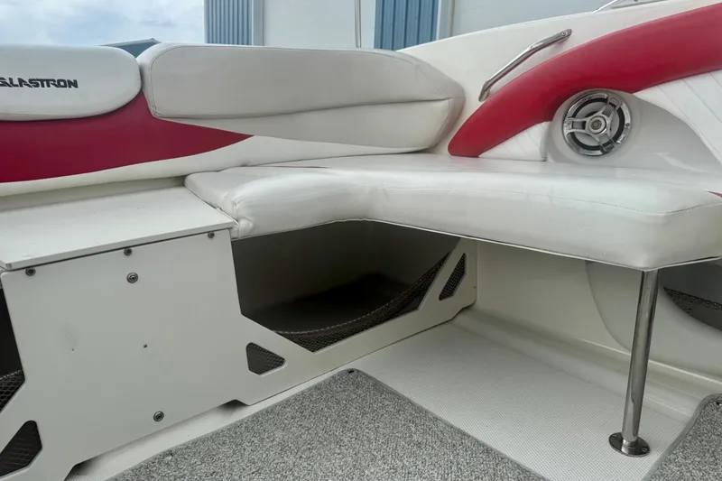 Slide: The Image of 2008 Glastron GT 225 boat interior with white and red seating and speaker detail. - 33