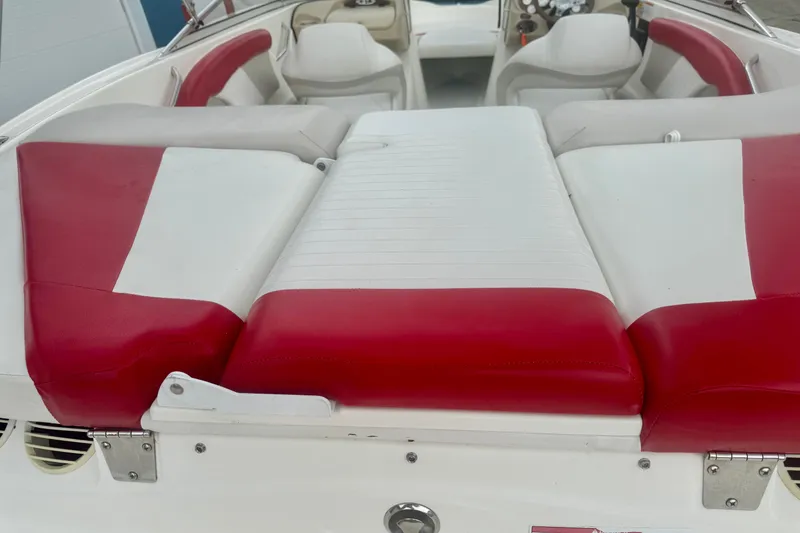 Slide: The Image of 2008 Glastron GT 225 boat interior with red and white seating. - 21