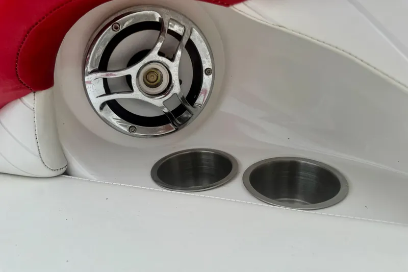 Slide: The Image of 2008 Glastron GT 225 boat interior with speaker and cup holders. - 57
