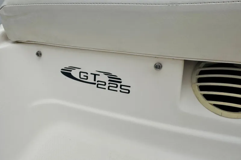 Slide: The Image of 2008 Glastron GT 225 boat logo on white surface, featuring sleek design elements. - 59