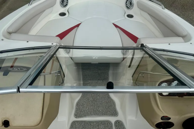 Slide: The Image of Interior view of a 2008 Glastron GT 225 boat, featuring sleek seating and dashboard. - 37